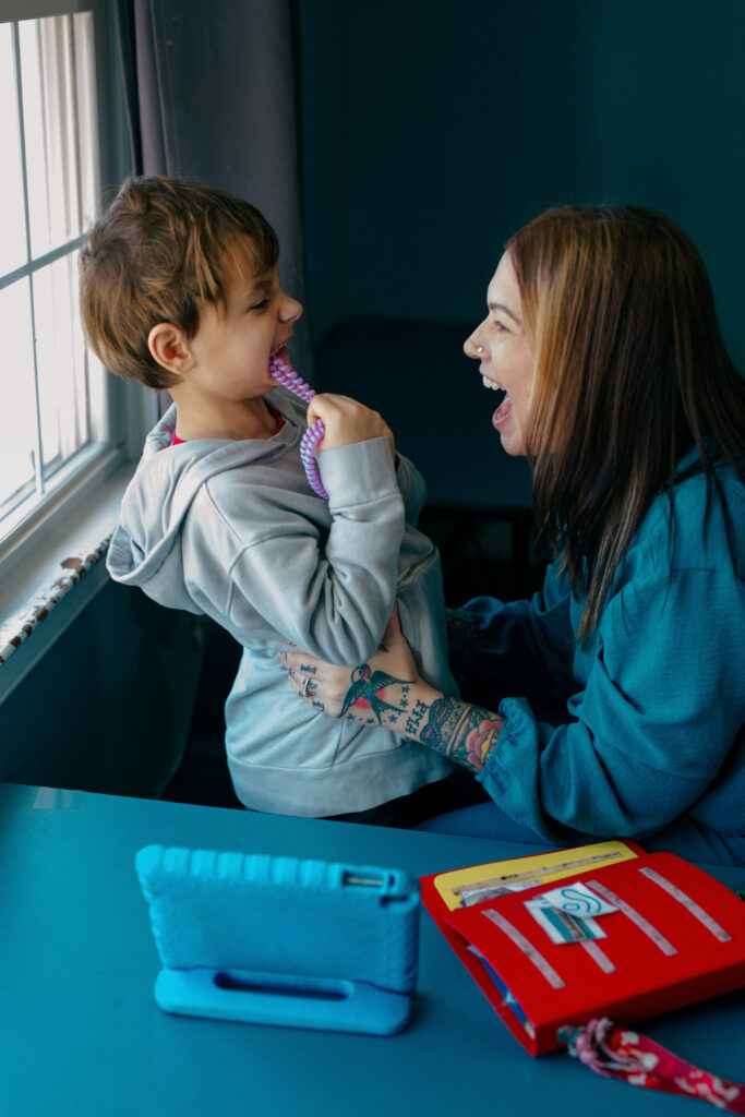 Director of Spiritos School playing with a student at their special education school in Virginia
