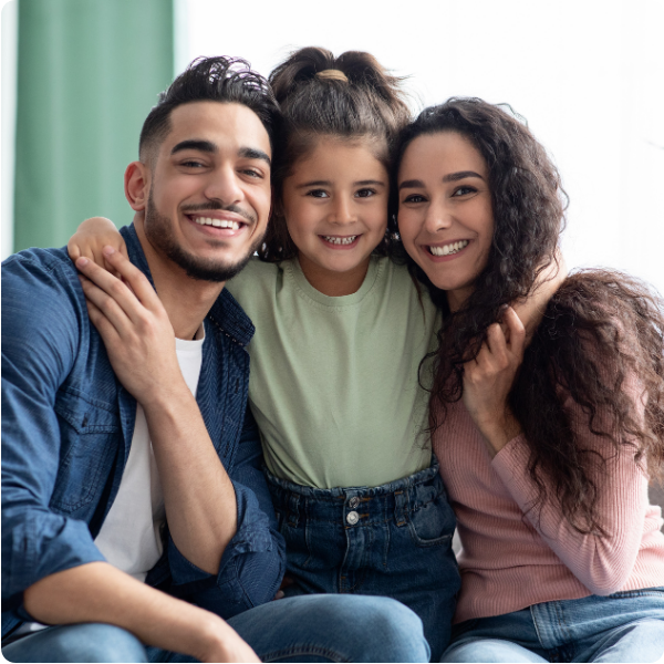 Parents posing with daughter smiling at the camera showing parent education through integrated services