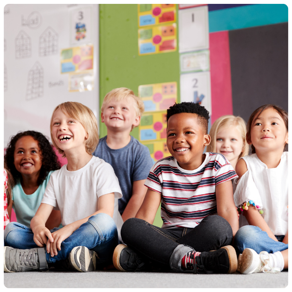 Group of diverse students sitting in class room at Spiritos School